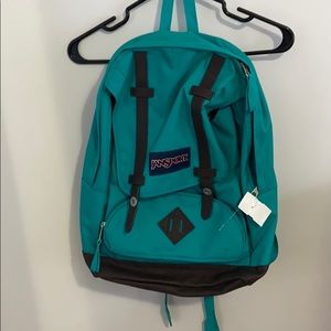 Teal Jansport backpack.